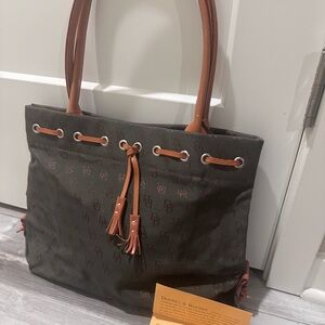 Dooney & Bourke signature canvas tassel tote bag with leather trim